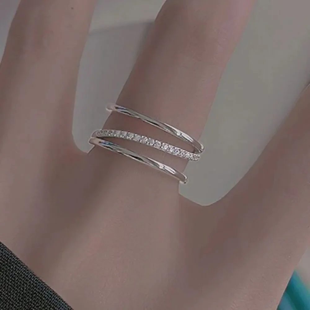 - The Triple Bling Ring adjustable in 925 silver & cubic zirconia